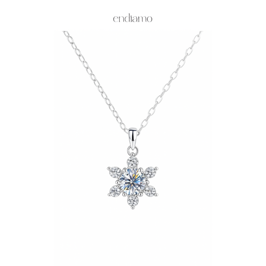 Snowflake-shaped silver pendant necklace on a white background with 'endiamo' branding.